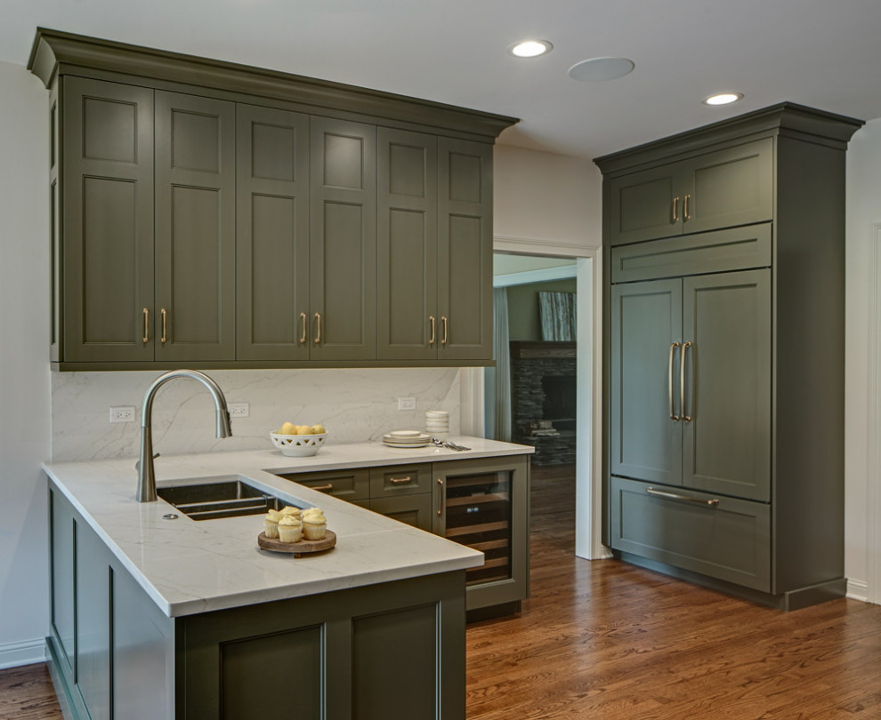 Design ideas for a large transitional l-shaped eat-in kitchen in Chicago with recessed-panel cabinets and green cabinets.