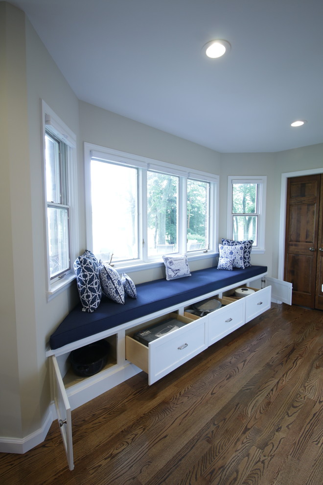 Open concept kitchen - huge transitional medium tone wood floor open concept kitchen idea with an undermount sink, shaker cabinets, white cabinets, marble countertops, white backsplash, ceramic backsplash, stainless steel appliances and two islands