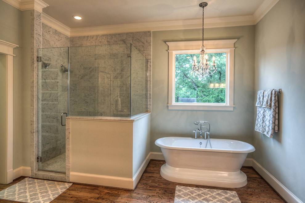 Design ideas for a large arts and crafts master bathroom in Houston with an undermount sink, shaker cabinets, grey cabinets, marble benchtops, a freestanding tub, a double shower, gray tile, stone slab, green walls and dark hardwood floors.