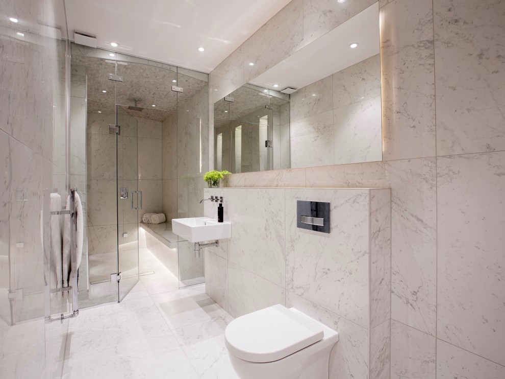 Photo of a mid-sized contemporary 3/4 bathroom in London with an open shower, a wall-mount toilet, multi-coloured tile, porcelain tile, multi-coloured walls, porcelain floors and a wall-mount sink.