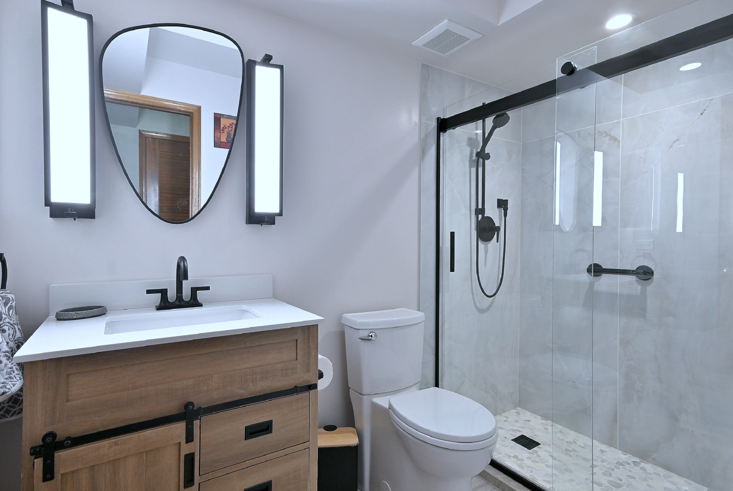 Modern Transitional Bathroom with Sliding Barn Door Vanity
