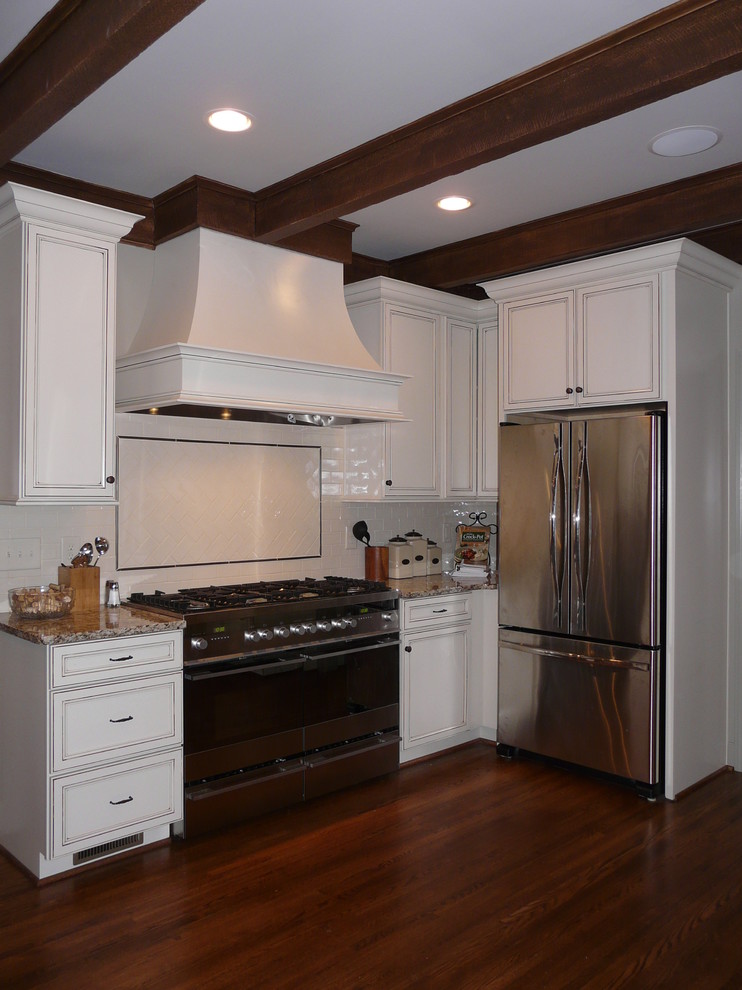 Transitional eat-in kitchen photo in Birmingham with a farmhouse sink, flat-panel cabinets, granite countertops, porcelain backsplash and stainless steel appliances