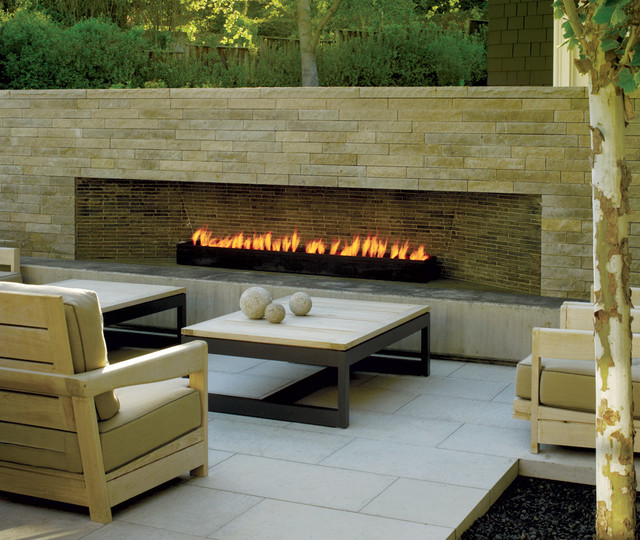 Landscape architect Andrea Cochran added warmth to this outdoor living space with a long modern fireplace. Photo by Marion Brenner for California Home + Design