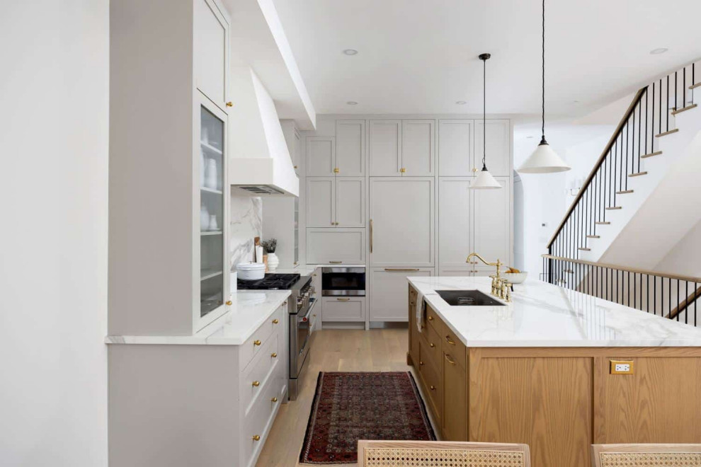 Example of a transitional kitchen design in Toronto