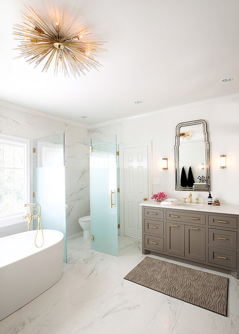 Mid-sized transitional master gray tile, white tile and stone tile marble floor freestanding bathtub photo in Houston with shaker cabinets, beige cabinets, white walls, an integrated sink and solid surface countertops