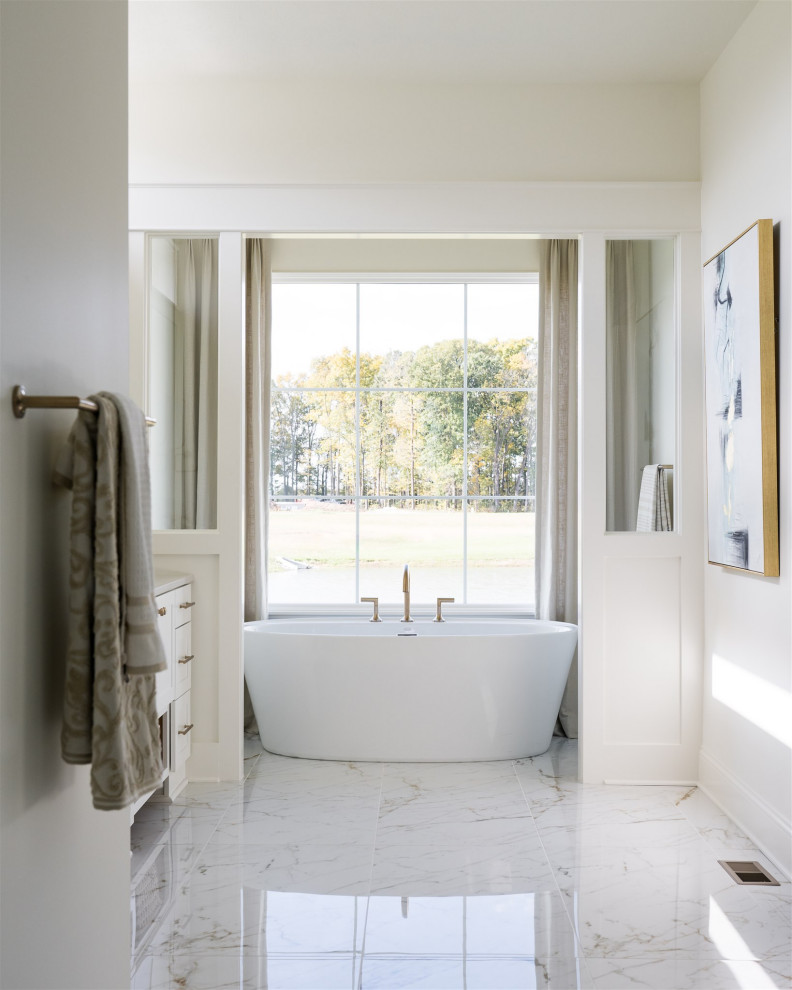 Inspiration for a mid-sized beach style master wet room bathroom in Indianapolis with shaker cabinets, white cabinets, a corner tub, white walls, marble floors, a vessel sink, engineered quartz benchtops, white benchtops, a double vanity and a built-in vanity.