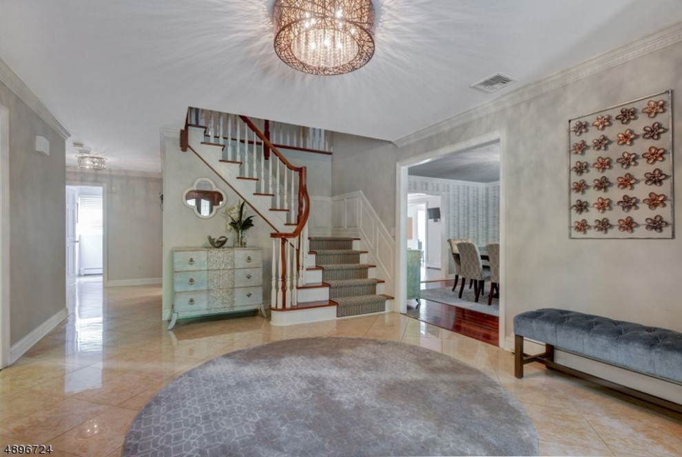 Inspiration for a large transitional multicolored floor foyer remodel