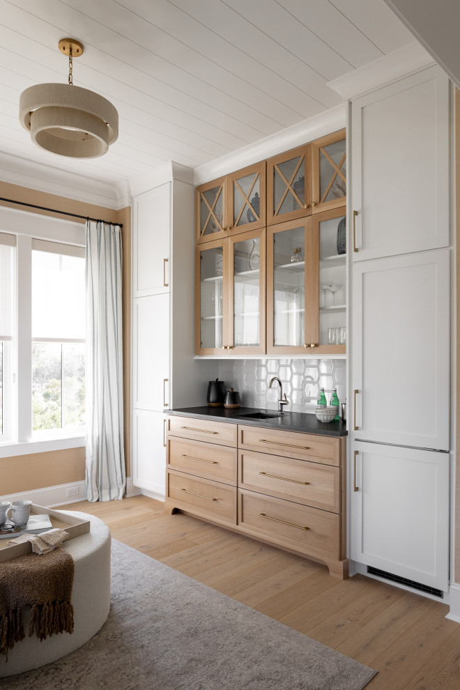 Inspiration for a coastal home bar remodel in Charleston