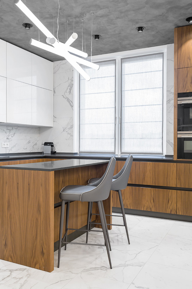 Photo of a contemporary u-shaped open plan kitchen in Moscow with flat-panel cabinets, white splashback, stone tile splashback, black appliances, marble floors and with island.