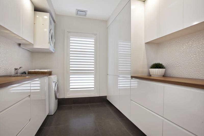 This is an example of a contemporary laundry room in Central Coast.