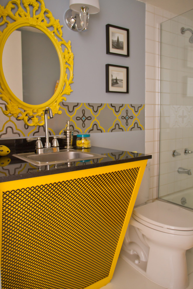 Contemporary bathroom in Los Angeles with a drop-in sink and yellow cabinets.