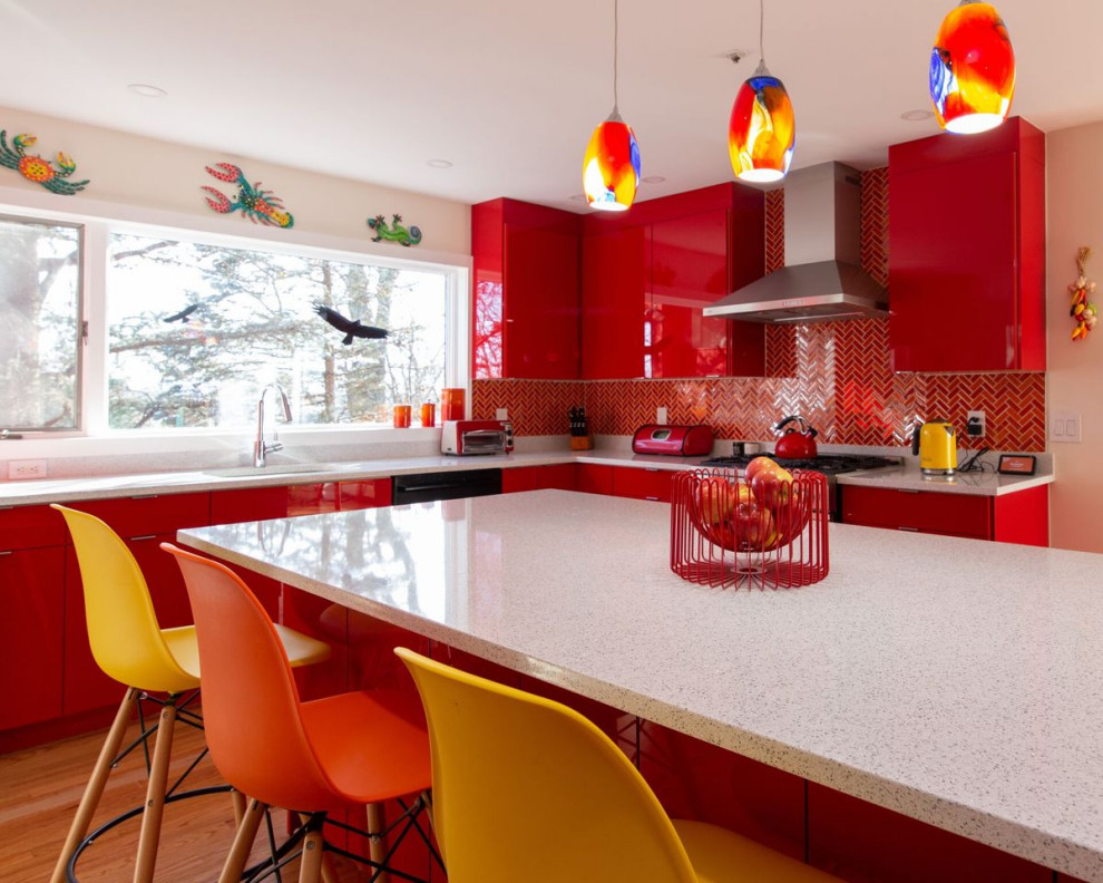 Example of a mid-sized eclectic l-shaped light wood floor and brown floor eat-in kitchen design in New York with an undermount sink, flat-panel cabinets, red cabinets, quartz countertops, multicolored backsplash, ceramic backsplash, stainless steel appliances, an island and white countertops