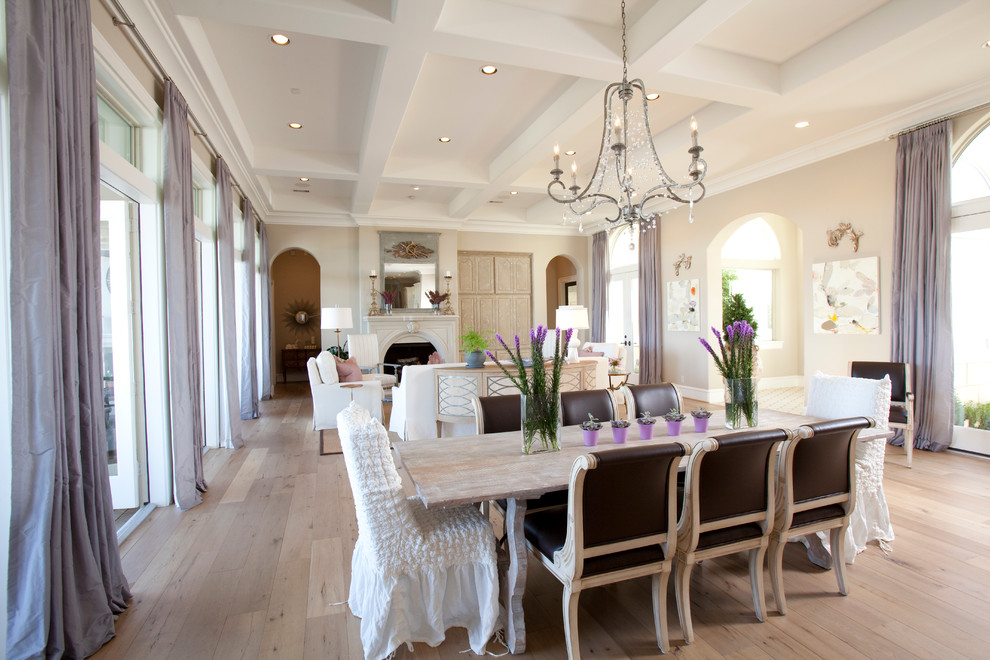This is an example of a transitional open plan dining in Houston.