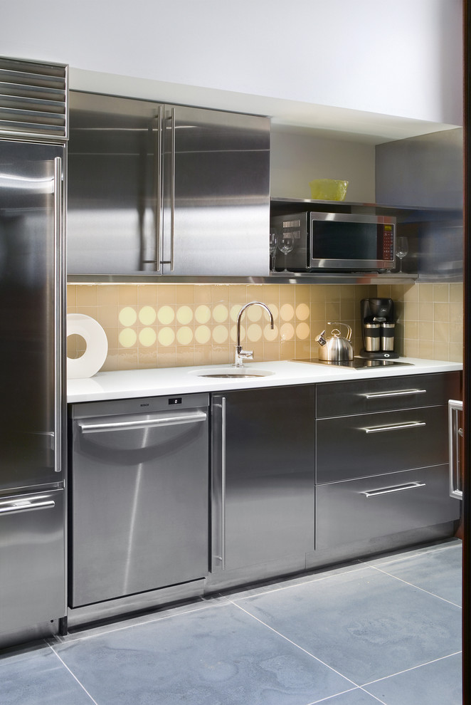 Small modern single-wall kitchen in New York with an undermount sink, flat-panel cabinets, grey cabinets, marble benchtops, yellow splashback, glass tile splashback and slate floors.