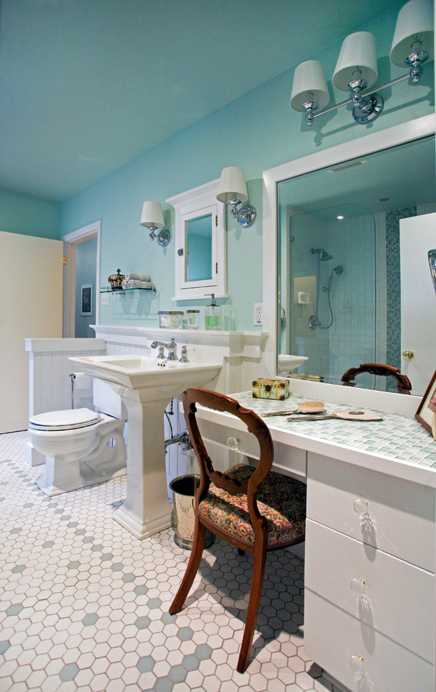 Photo of a mid-sized traditional master bathroom in Calgary with flat-panel cabinets, white cabinets, an alcove tub, an alcove shower, a two-piece toilet, beige tile, green tile, mosaic tile, green walls, cement tiles, a pedestal sink and tile benchtops.