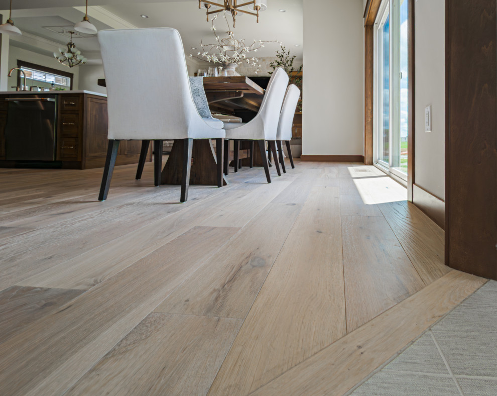 Example of a transitional light wood floor and beige floor eat-in kitchen design