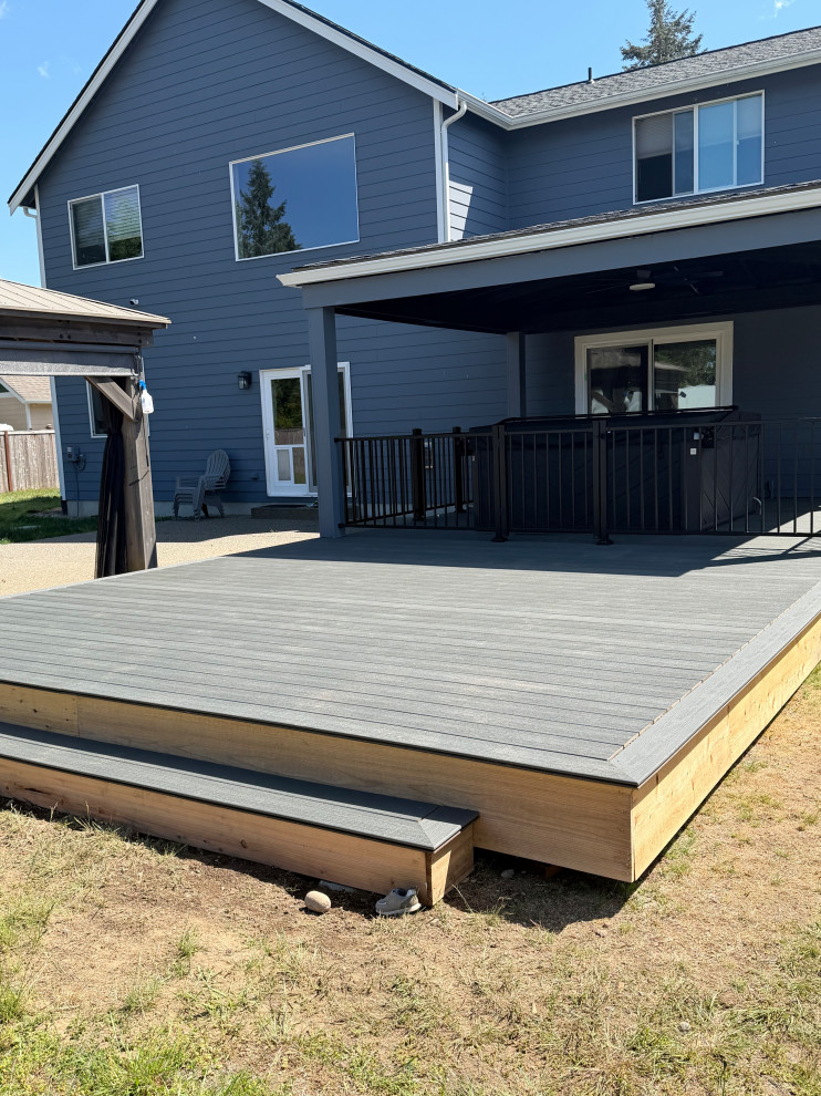 The new deck with the hot tub and sliding door into home