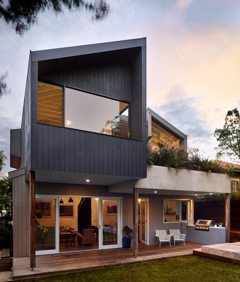 Design ideas for a mid-sized contemporary two-storey exterior in Sydney.