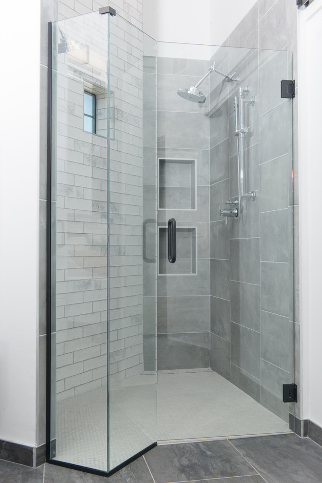Mid-sized industrial master bathroom in Phoenix with flat-panel cabinets, white cabinets, a freestanding tub, a curbless shower, a one-piece toilet, white tile, ceramic tile, white walls, ceramic floors, a vessel sink, quartzite benchtops, grey floor, a hinged shower door and white benchtops.