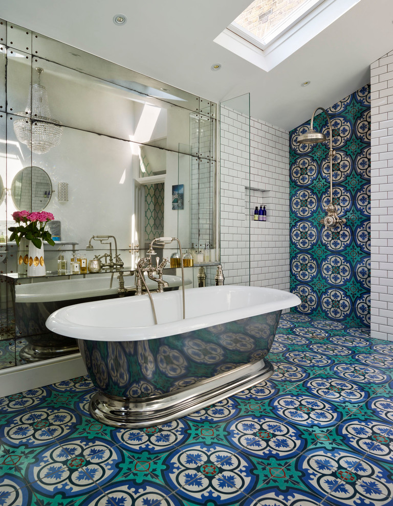 This is an example of a large traditional bathroom in Austin with a freestanding tub, an alcove shower, multi-coloured tile, cement tile, white walls and mosaic tile floors.