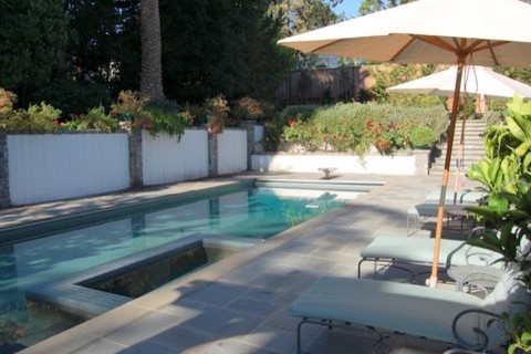 Inspiration for a large traditional backyard rectangular pool in San Francisco with natural stone pavers.