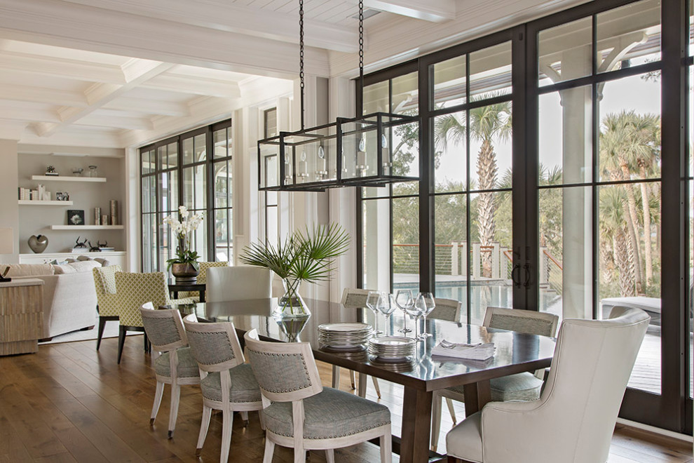 Beach style open plan dining in Charleston with medium hardwood floors, no fireplace and timber.