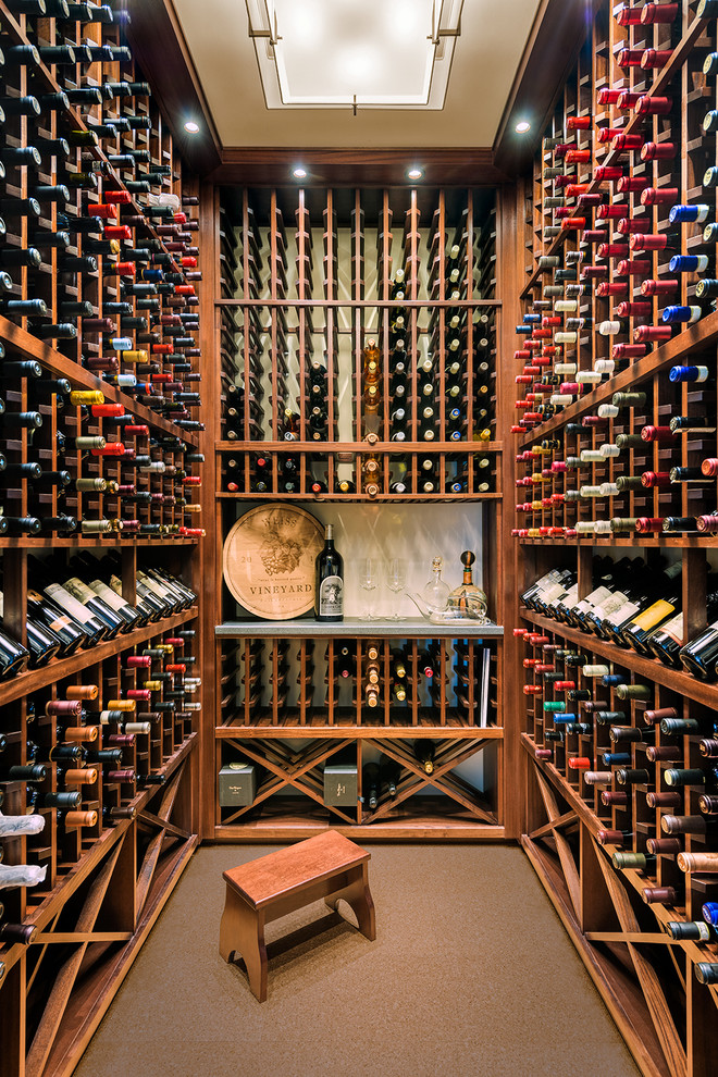 Transitional wine cellar in Philadelphia with cork floors and storage racks.
