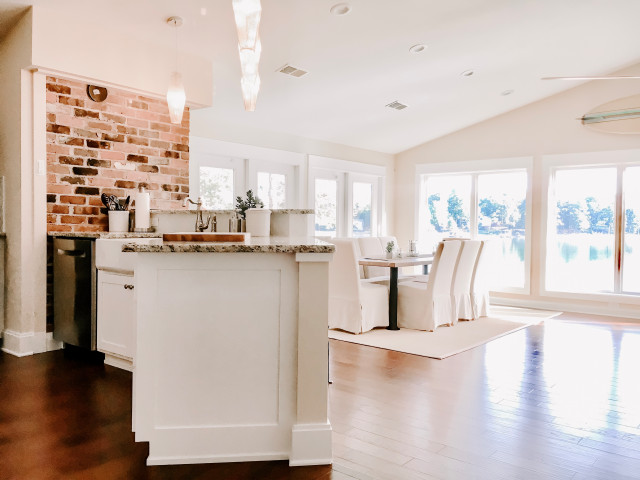 Inspiration for a mid-sized eclectic medium tone wood floor and brown floor great room remodel in Charlotte with yellow walls