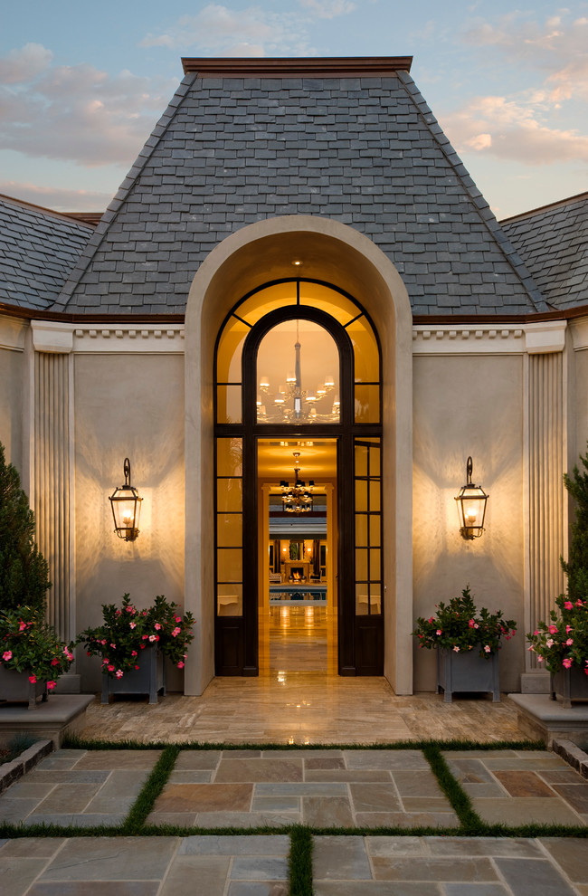 Traditional entryway in Santa Barbara with a glass front door.