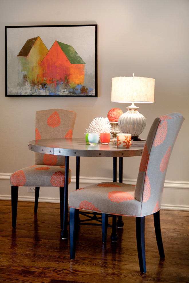 Photo of a mid-sized contemporary dining room in New York with grey walls, medium hardwood floors, no fireplace and brown floor.