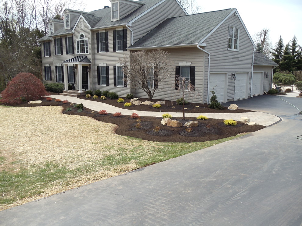 Inspiration for a mid-sized arts and crafts front yard partial sun garden in Philadelphia with a garden path and concrete pavers.