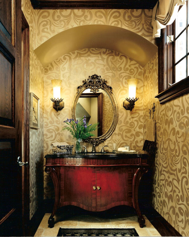 Photo of a mid-sized traditional powder room in Detroit with furniture-like cabinets, brown cabinets, a one-piece toilet, beige walls, ceramic floors, a drop-in sink, marble benchtops, beige floor and grey benchtops.
