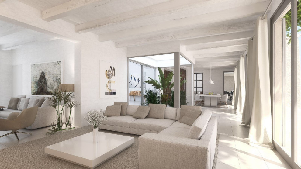 Inspiration for a large mediterranean open concept family room in Palma de Mallorca with a library, white walls, ceramic floors, no fireplace, no tv, grey floor and exposed beam.