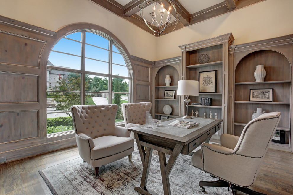 Large mediterranean study room in Dallas with medium hardwood floors, no fireplace and a freestanding desk.