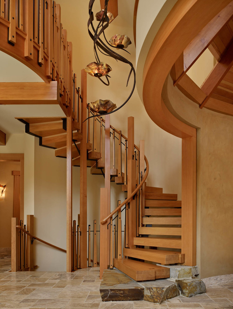 This is an example of a country wood spiral staircase in Seattle with open risers.