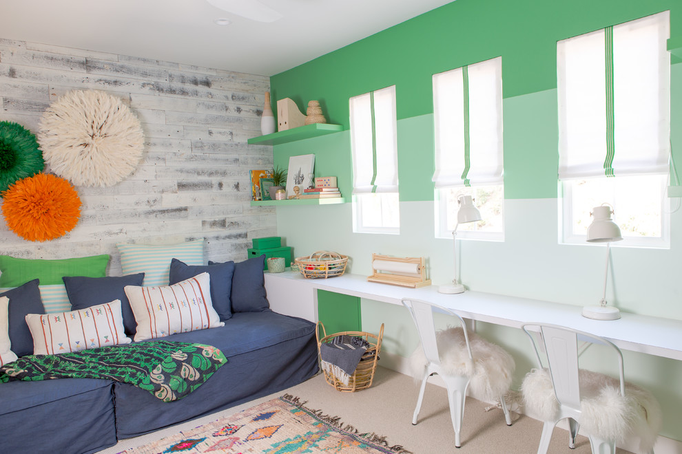 Example of a trendy gender-neutral carpeted and beige floor kids' study room design in San Diego with green walls