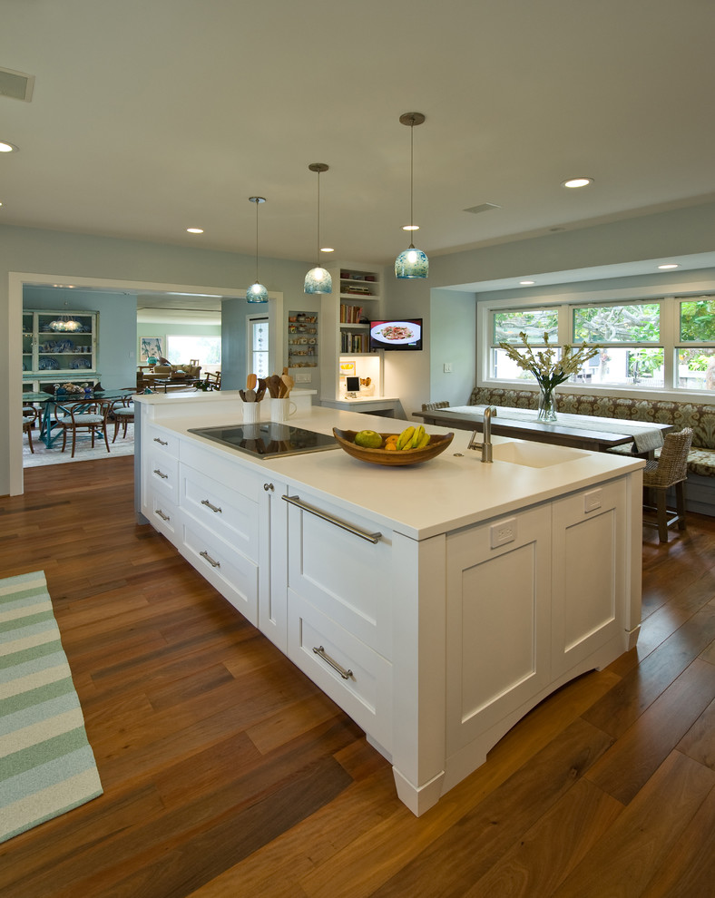 Inspiration for a tropical kitchen pantry in Hawaii with an integrated sink, shaker cabinets, blue cabinets, solid surface benchtops, panelled appliances and with island.