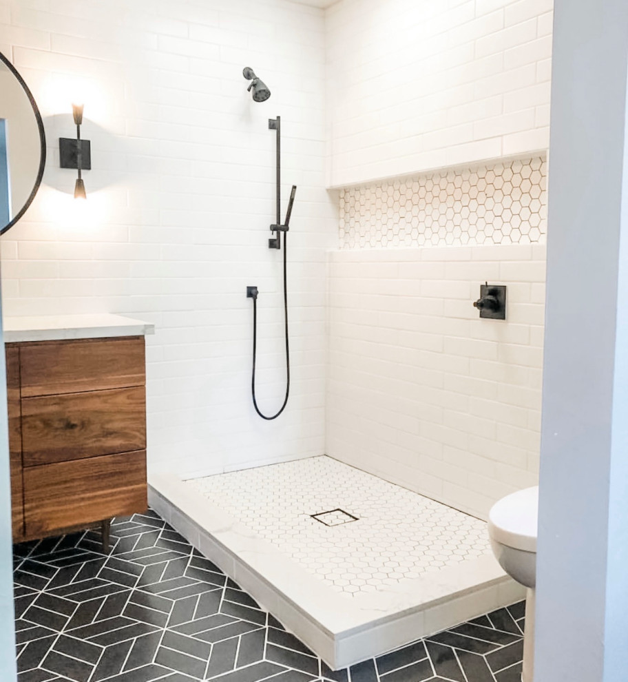 Corner shower - mid-sized contemporary master white tile and ceramic tile porcelain tile, black floor and single-sink corner shower idea in Chicago with flat-panel cabinets, brown cabinets, a two-piece toilet, white walls, an undermount sink, quartz countertops, white countertops, a freestanding vanity and a niche