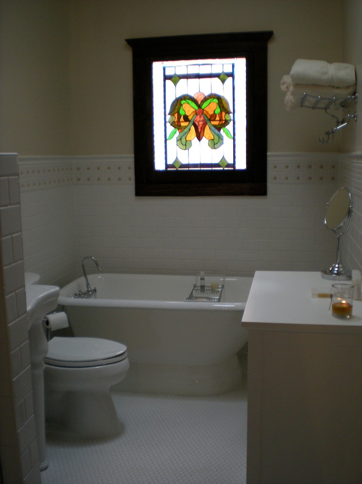 Design ideas for a mid-sized traditional 3/4 bathroom in Atlanta with a pedestal sink, shaker cabinets, white cabinets, granite benchtops, a claw-foot tub, white tile, ceramic tile, yellow walls and mosaic tile floors.