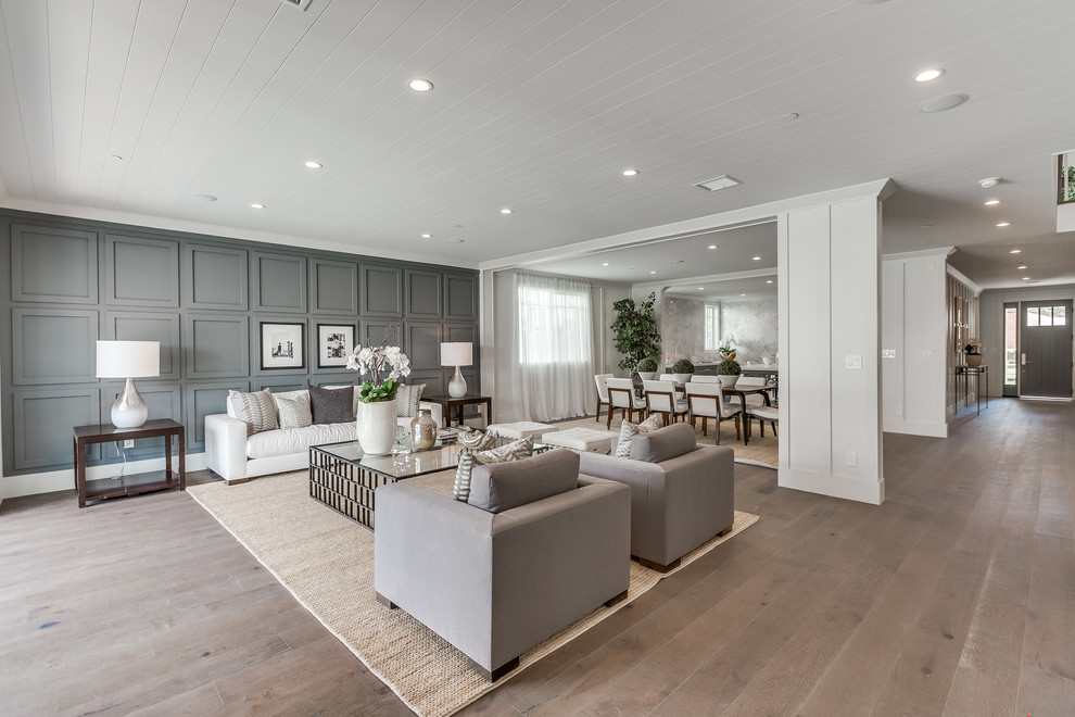Living room - large contemporary formal and open concept medium tone wood floor and brown floor living room idea in Los Angeles with gray walls, no fireplace and no tv