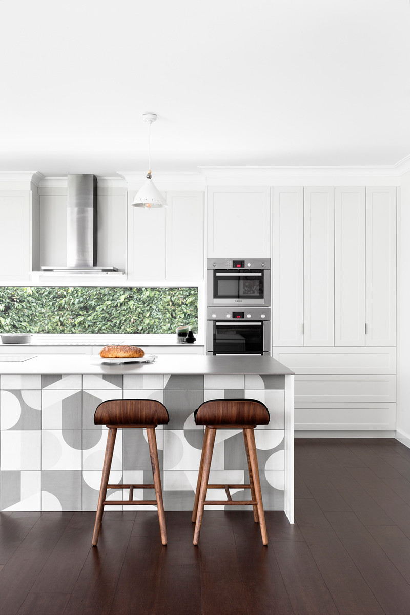 Inspiration for a large scandinavian galley open plan kitchen in Melbourne with an undermount sink, shaker cabinets, white cabinets, quartz benchtops, window splashback, stainless steel appliances, dark hardwood floors and with island.