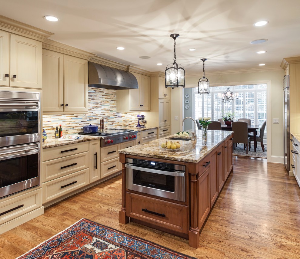 Enclosed kitchen - mid-sized transitional u-shaped dark wood floor and brown floor enclosed kitchen idea in Charlotte with shaker cabinets, beige cabinets, granite countertops, multicolored backsplash, matchstick tile backsplash, stainless steel appliances and an island