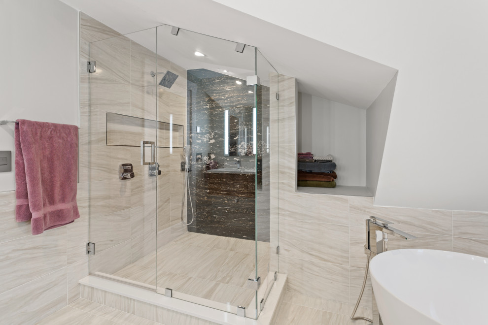Inspiration for a mid-sized modern master bathroom in Boston with flat-panel cabinets, dark wood cabinets, a freestanding tub, a corner shower, a two-piece toilet, beige tile, porcelain tile, beige walls, porcelain floors, an undermount sink, solid surface benchtops, beige floor, a hinged shower door and white benchtops.