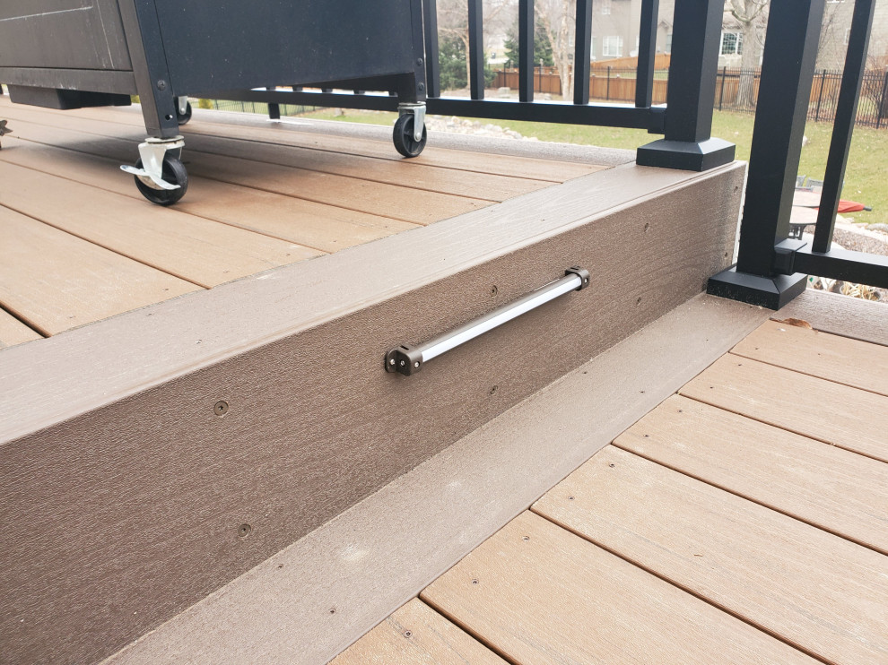 Inspiration for a large backyard second story metal railing deck remodel with no cover