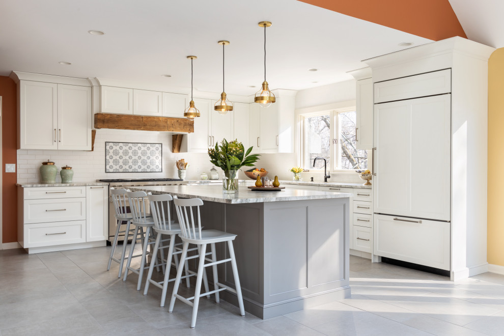Inspiration for a large country l-shaped eat-in kitchen in New York with an undermount sink, recessed-panel cabinets, white cabinets, quartzite benchtops, white splashback, subway tile splashback, stainless steel appliances, porcelain floors, with island, grey floor and vaulted.