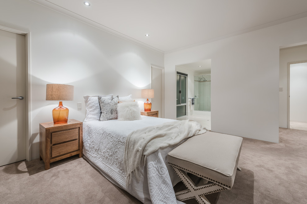 This is an example of a contemporary master bedroom in Perth with white walls and carpet.