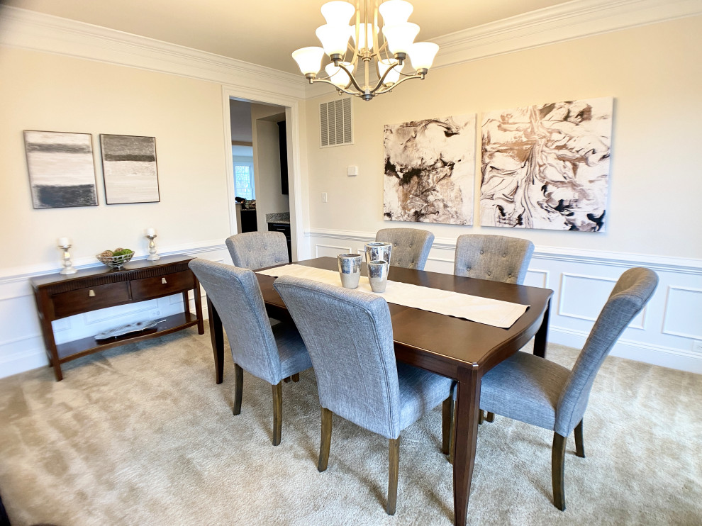 Photo of a large transitional separate dining room in DC Metro with white walls, carpet, no fireplace, white floor and decorative wall panelling.