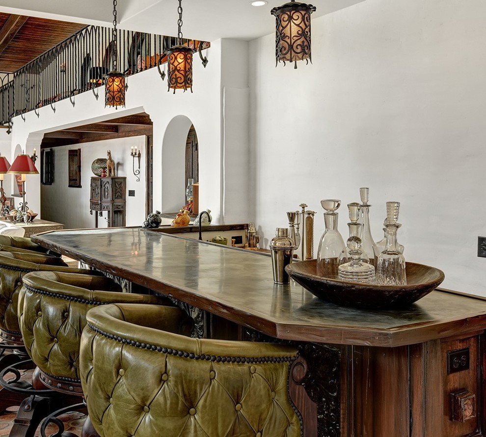 Inspiration for a mediterranean home bar in Orange County.