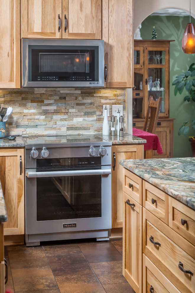 Inspiration for a mid-sized rustic vinyl floor kitchen remodel with an undermount sink, recessed-panel cabinets, light wood cabinets, granite countertops, stainless steel appliances and an island