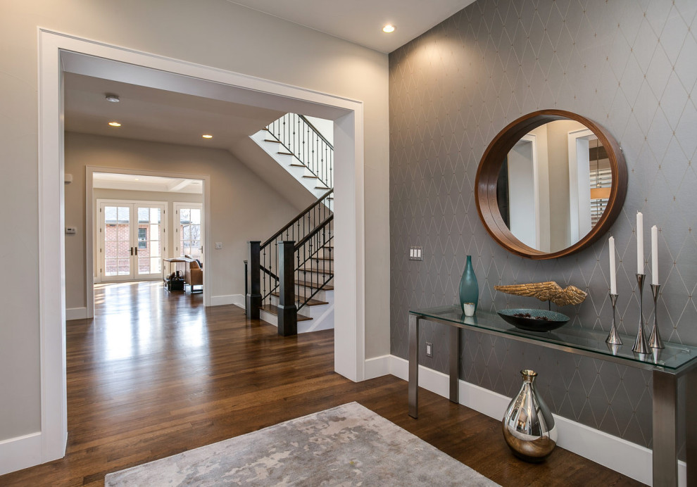 Front door - mid-sized transitional dark wood floor and brown floor front door idea in Miami with beige walls and a brown front door